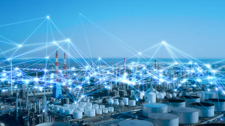 Industrial scene with overlay of connecting bright lines.