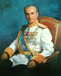 Former Shah of Iran, Mohammad Reza Pahlavi, poseing for a portrait in military uniform.