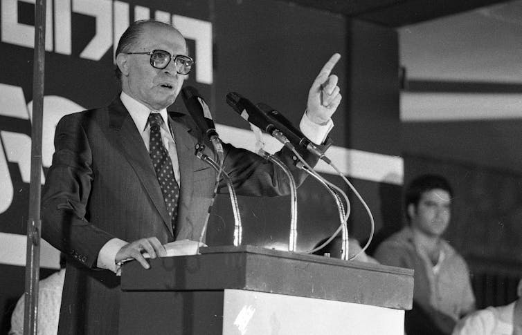 A man stands at a podium.