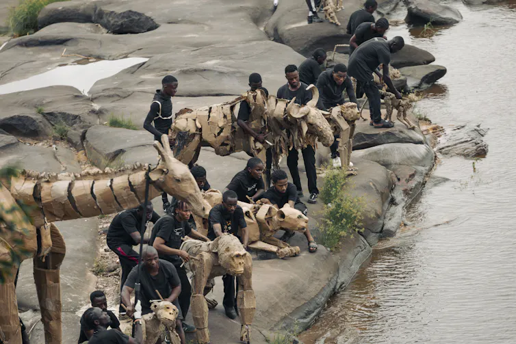 ANIMAL puppets by watering hole in africa