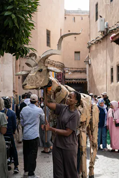 animal puppets in crowds in Morocco