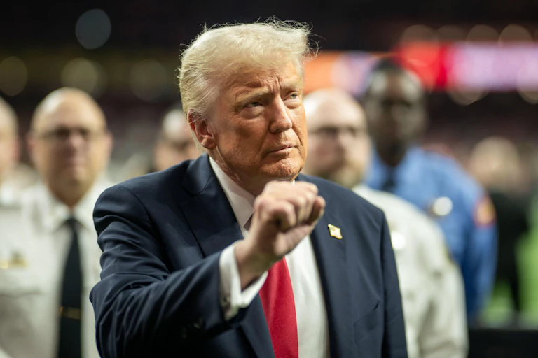 Donald Trump raises his fist.