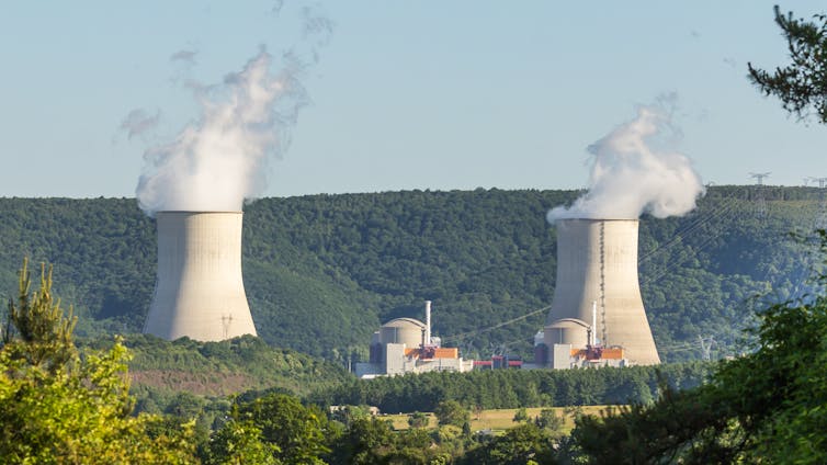 The smoking stacks of a nuclear power plant
