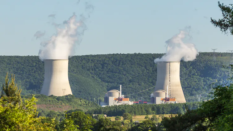 The smoking stacks of a nuclear power plant