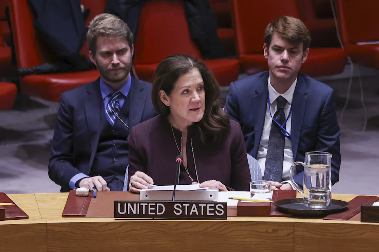 Interim US ambassador to the United Nations, Dorothy Camille Shea, addresses the security council flanked by two aides.