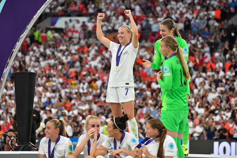 England's Beth Mead cheering on podium after win v Germany in the Women European Championship Final 2022