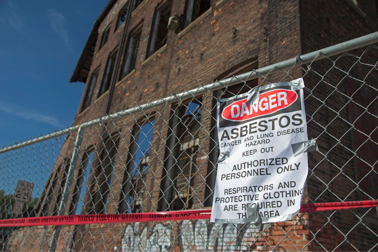 A warning of an asbestos hazard at the old Globe Trading Company building on Detroit's riverfront.