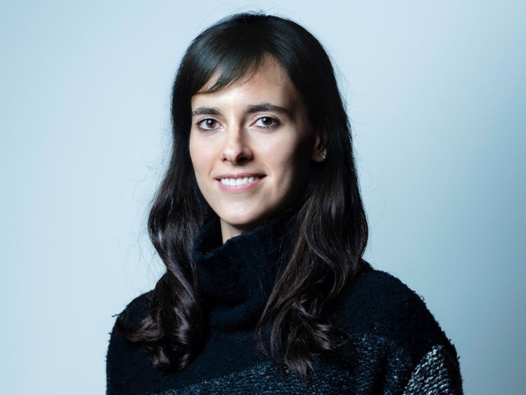 Carissa Veliz looks at the camera wearing a dark sweater.