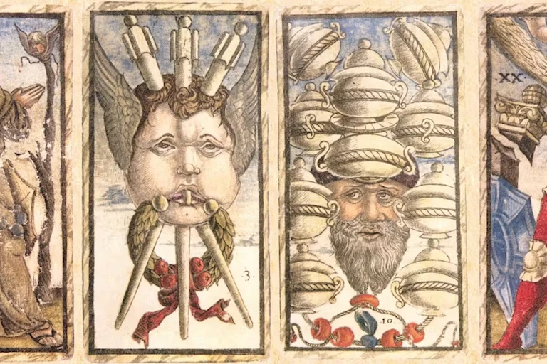 tarot cards with vivid drawings of faces