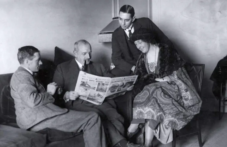 A black and white image of Agatha Christie and her husband Archie on the left).