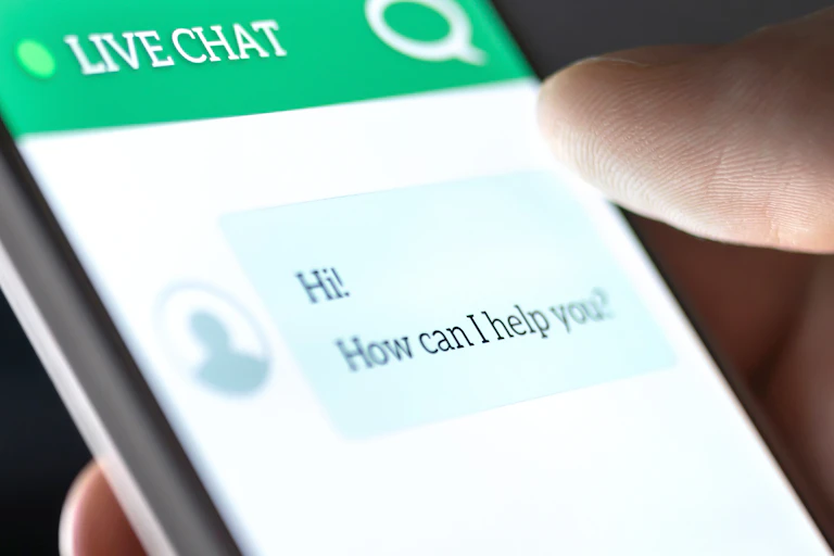 A phone screen showing a messaging system with a message from a user that says 'Hi! How can I help you?'