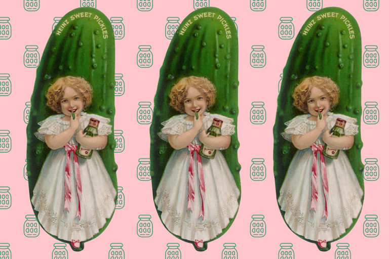 A girl in front of a giant pickle