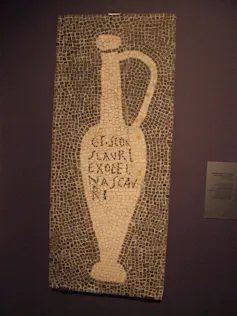 A mosaic of a bottle
