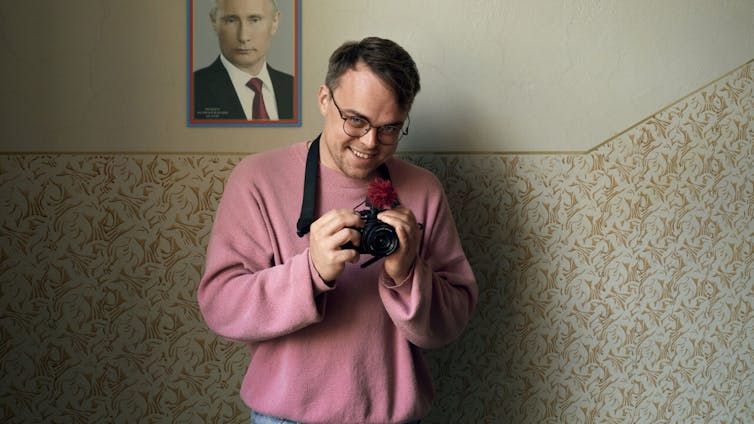Mr. No person In opposition to Putin provides an perception into the propaganda in Russian faculties 1 Pavel Talankin holding a camera