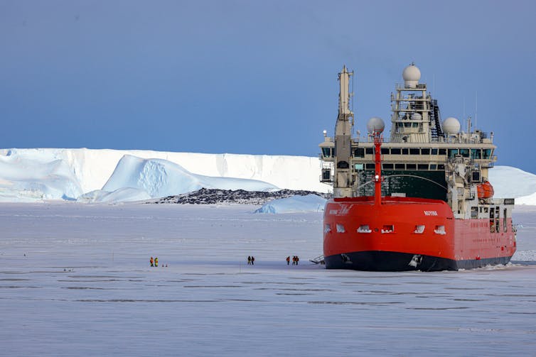An icebreaker delivers supplies to the Antarctic base