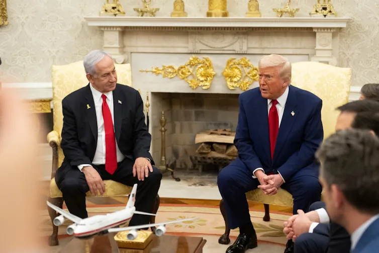 Donald Trump and Benjamin Netanyahu seated in the Oval Office.
