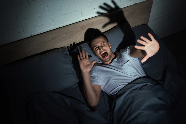 Man waking from a nightmare.