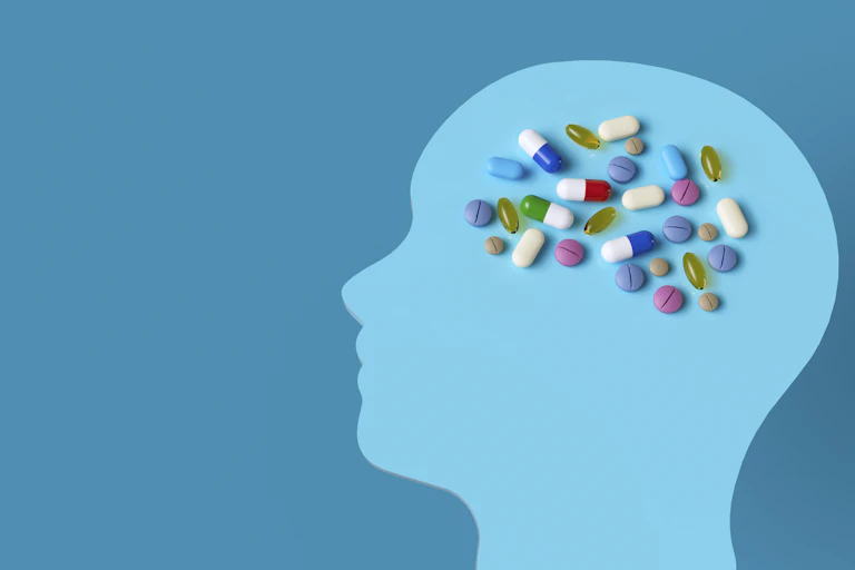 illustration of a head with medications where the brain should be.
