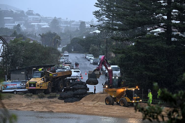 workers stabilise beach ahead of storm, NSW.