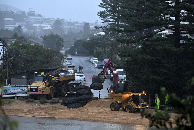 workers stabilise beach ahead of storm, NSW.