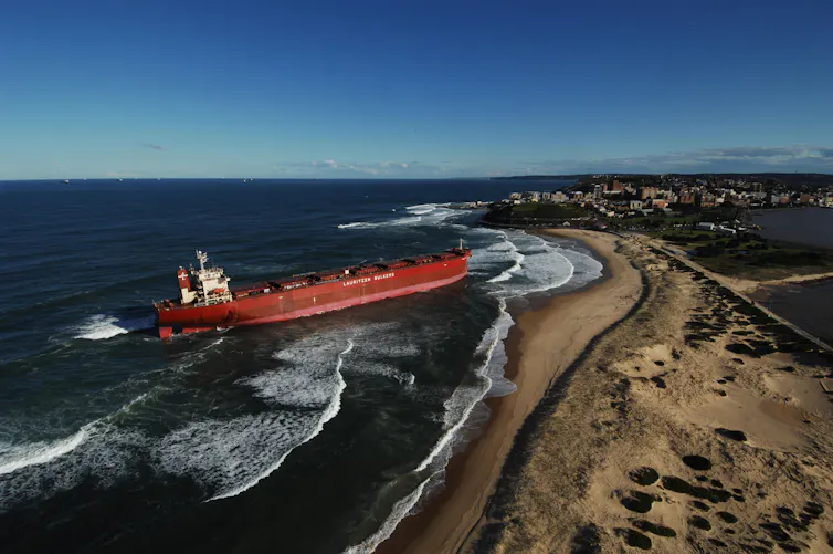 large ship driven ashore after storm, Pasha Bulker in Newcastle.
