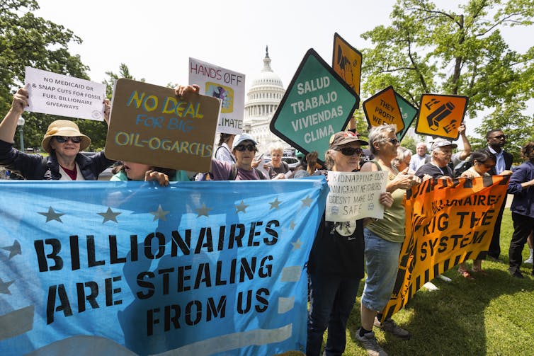 Protestors carrying banners outside Capitol Hill.