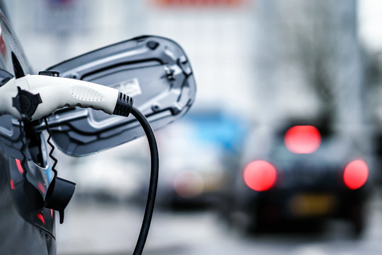 A close-up shot of an electric vehicle on charge.