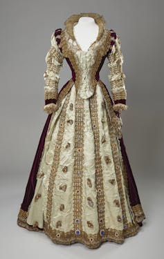 The Edwardians: Age of Class – a glimpse into royal patronage of the humanities within the early twentieth century 1 A 16th-century style dress in beige and maroon with a sweetheart neckline.