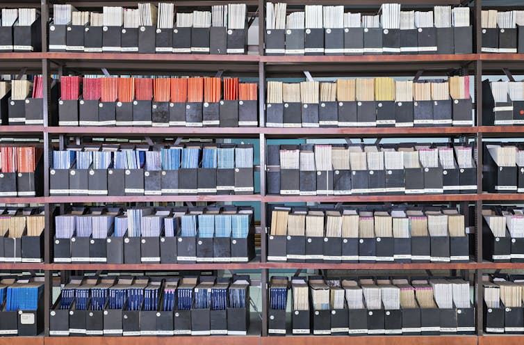 colorful journals with spines out on library shelves
