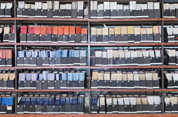 colorful journals with spines out on library shelves