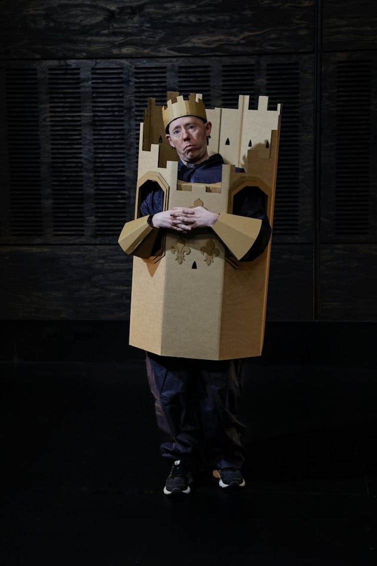 A person dressed up like a castle – or a king.