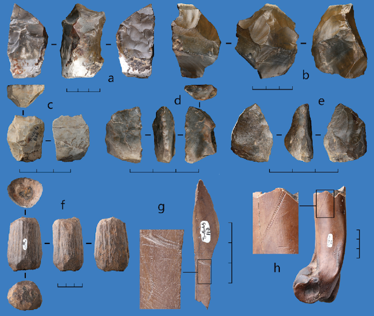 Photo of an assortment of stone and bone tools