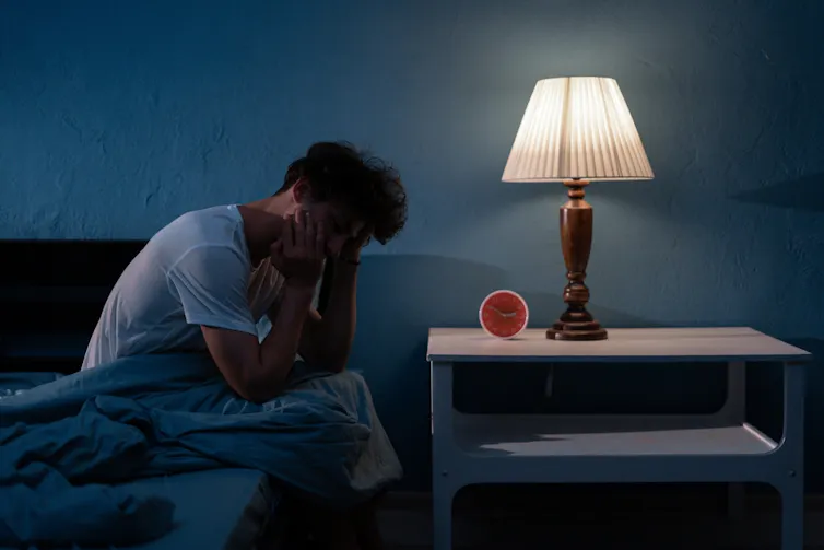 A man waking from a bad dream.