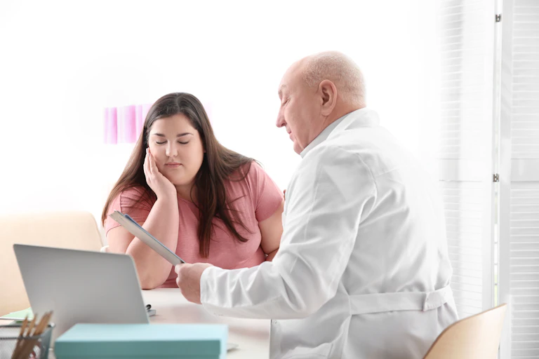 Woman having consultation at doctor's office