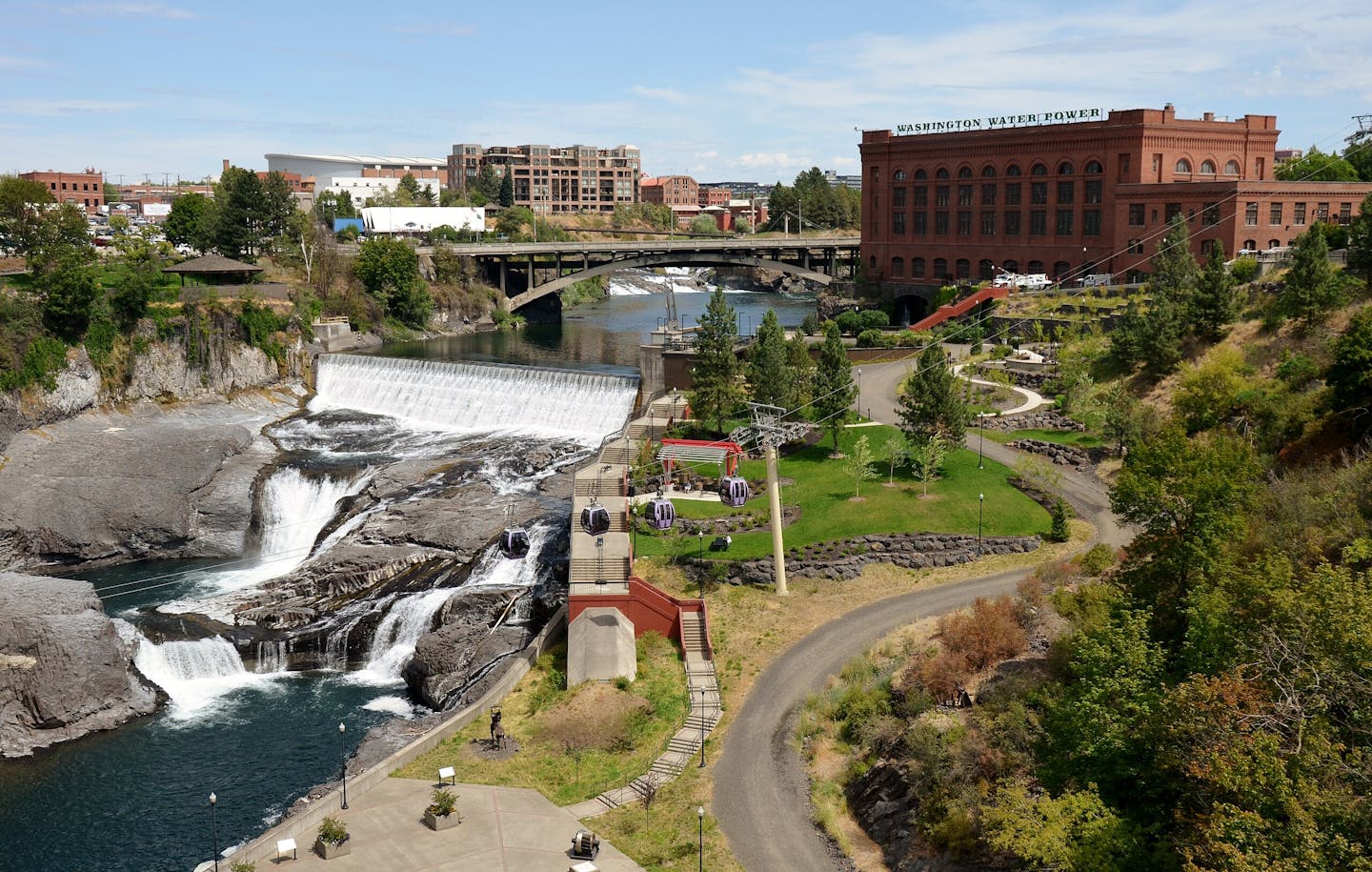 Spokane Falls includes a 25-foot dam and falls that tumble below it