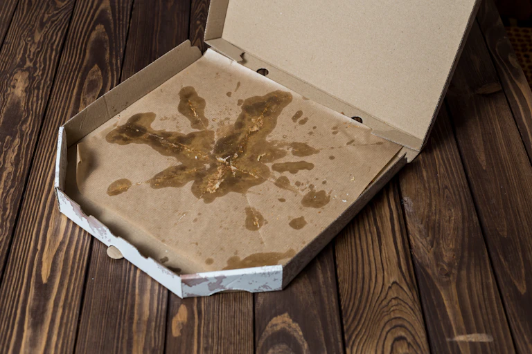A grease-stained pizza box.