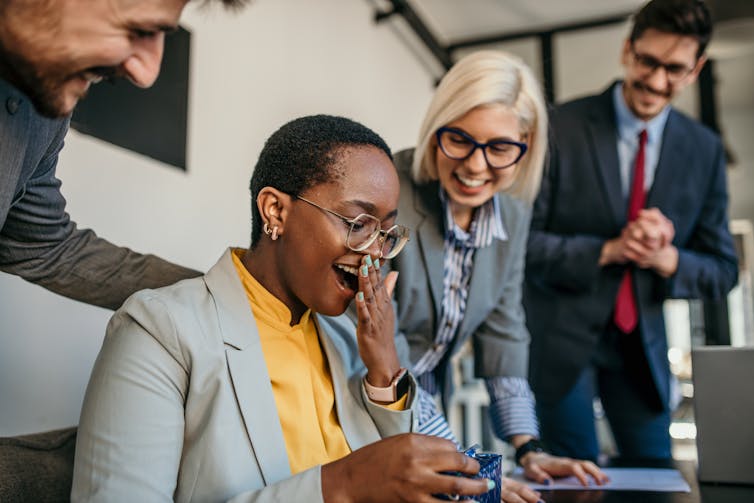 Tackling the chaos at domestic could be the name of the game to a extra a hit paintings existence 1 a surprised woman receiving a gift at her desk from her colleagues