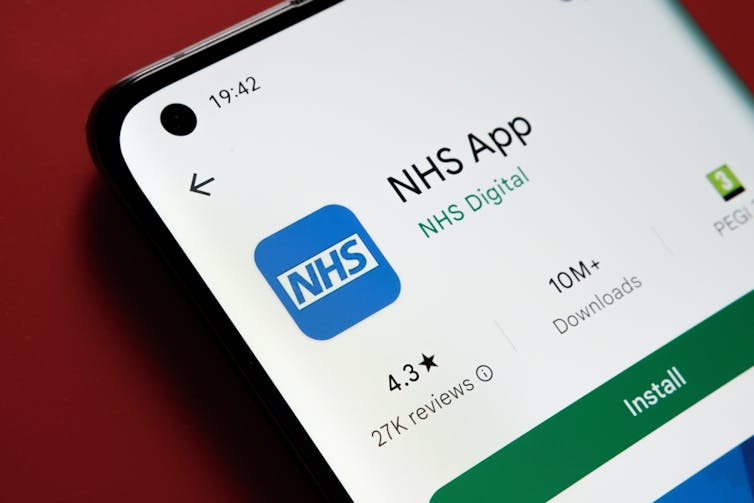 A mobile phone showing the NHS app.