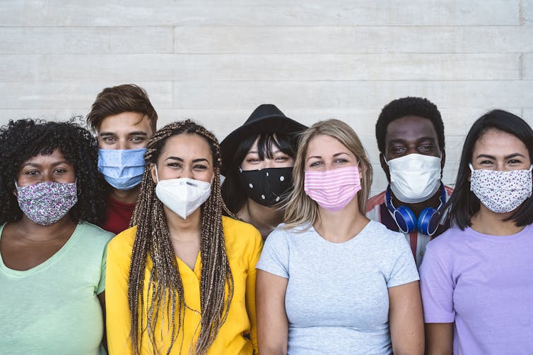 A group of youths wearing masks.