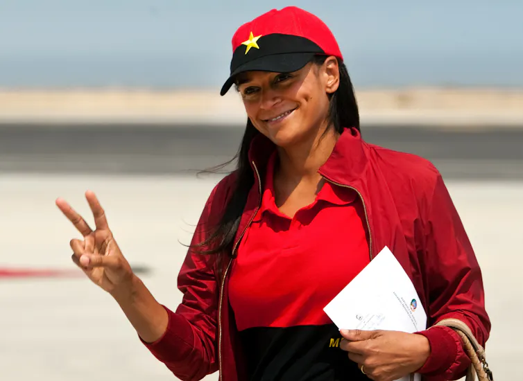 Isabel dos Santos wearing a cap featuring the Angolan flag.