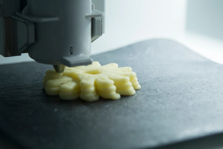 Layers of circular shapes underneath a nozzle