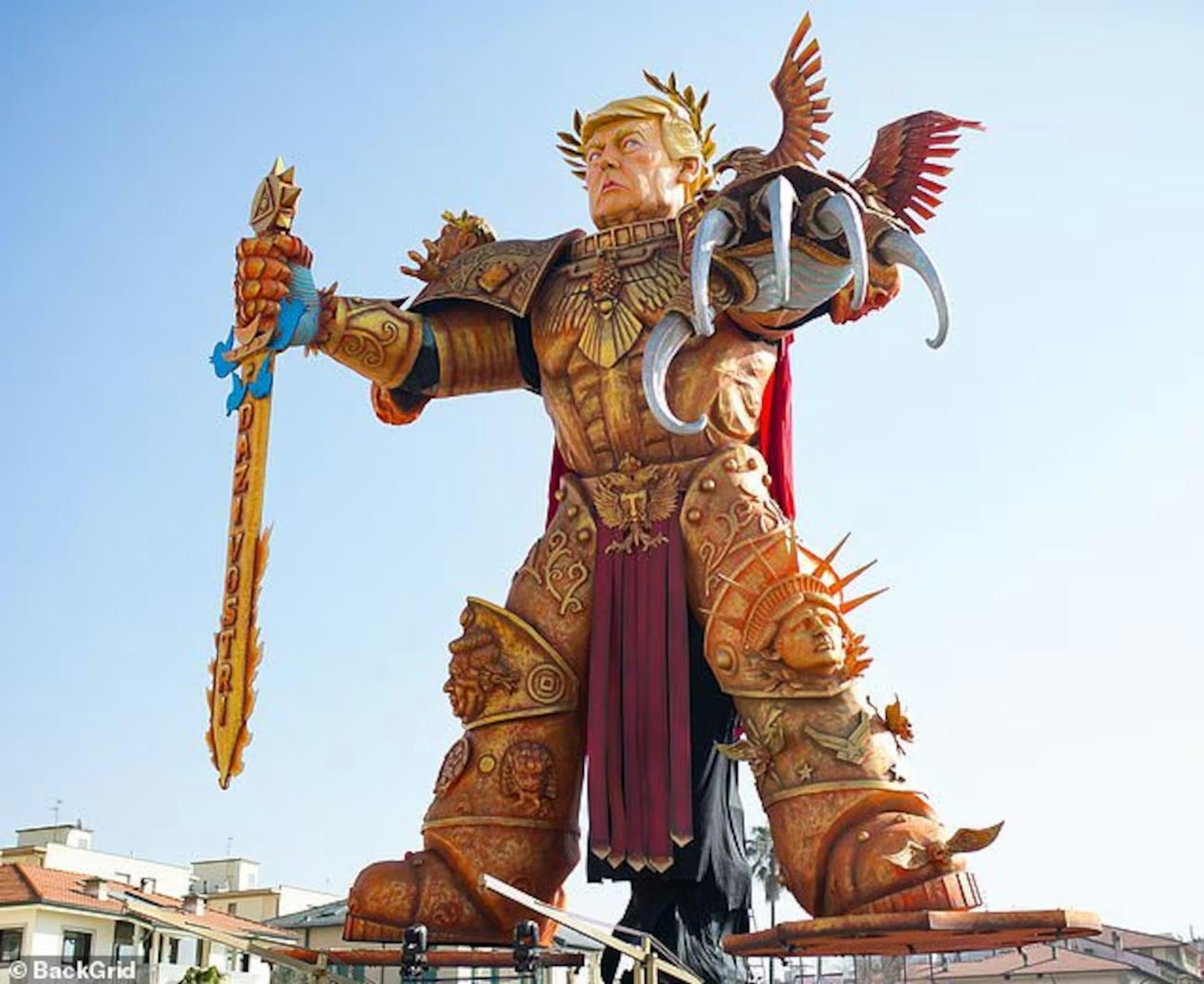 A paper mache sculpture of Donald Trump dressed up as a ruling emperor.