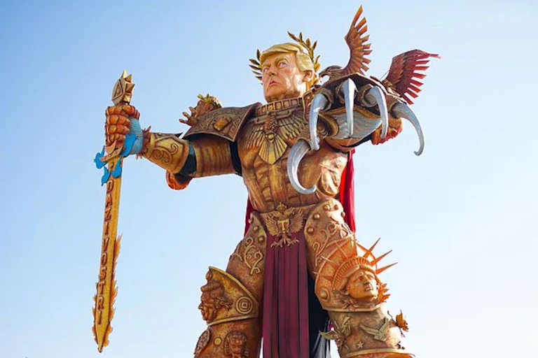 A paper mache sculpture of Donald Trump dressed up as a ruling emperor.