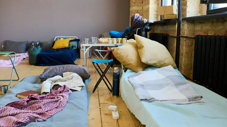 multiple makeshift beds can be seen