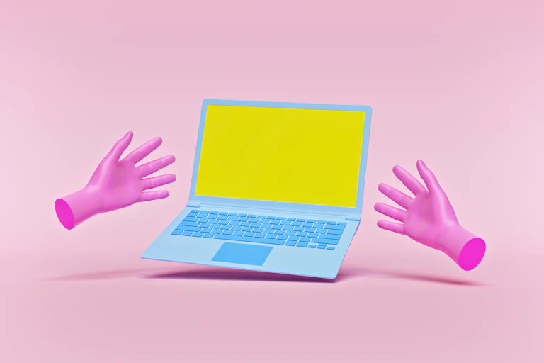 Laptop and pink hands isolated on pastel pink background.