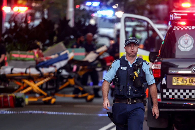 A police officer reacts outside the Westfield Bondi Junction shopping mall after a stabbing incident in 2024.