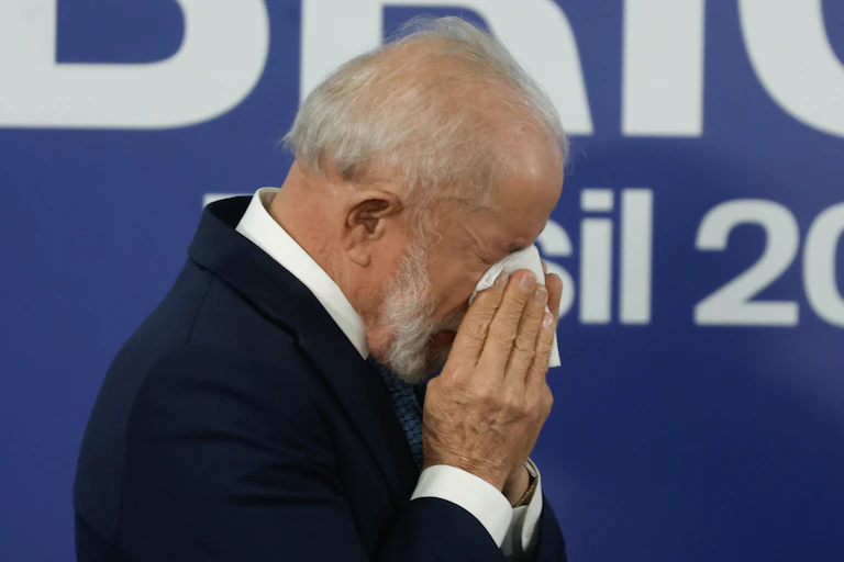 Brazil's president, Luiz Inácio 'Lula' da Silva, wipes his brow at the Brics summit in Rio de Janeiro.