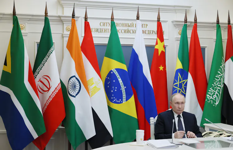 Putin participating in a Brics meeting via videoconference from the Kremlin.