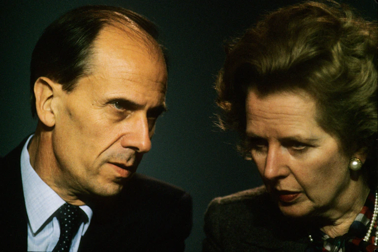 Close up photo of Tebbit and Thatcher's faces, close in conversation