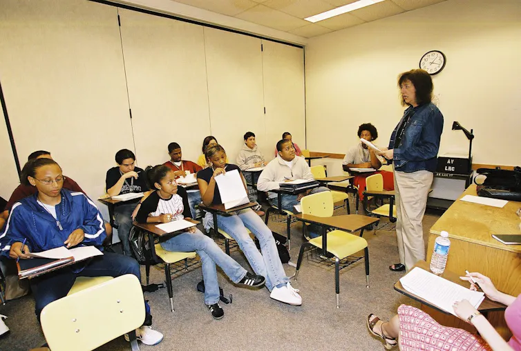 Photos of small college classroom with teacher and students